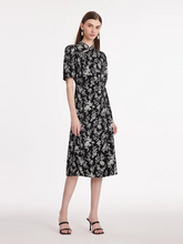 a lady in a camellia printed mandarin collared midi qipao